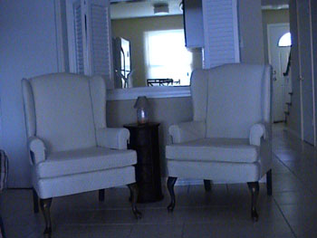 Two white formal chairs